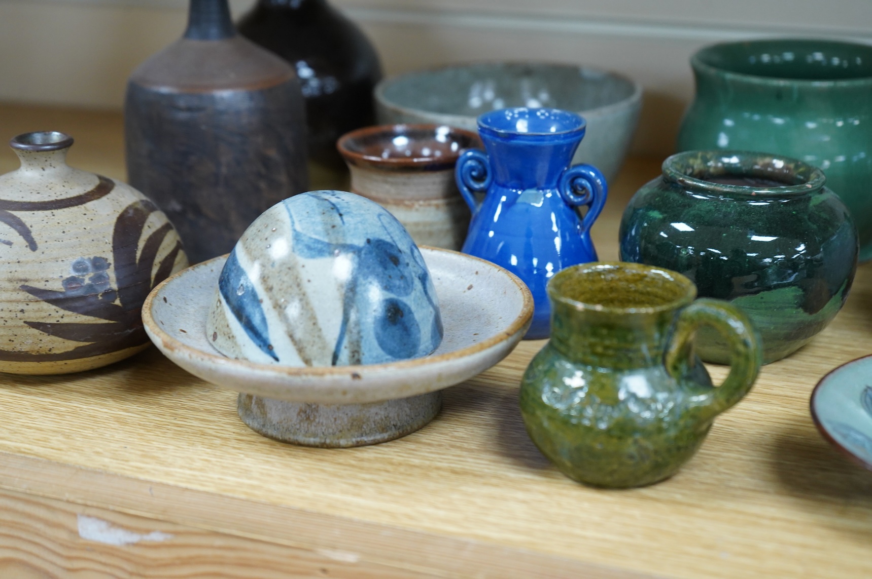 A collection of studio pottery to include a small Danish squat vase, a Brannam, Devon vase and three small Dickerware pieces, largest 13cm high